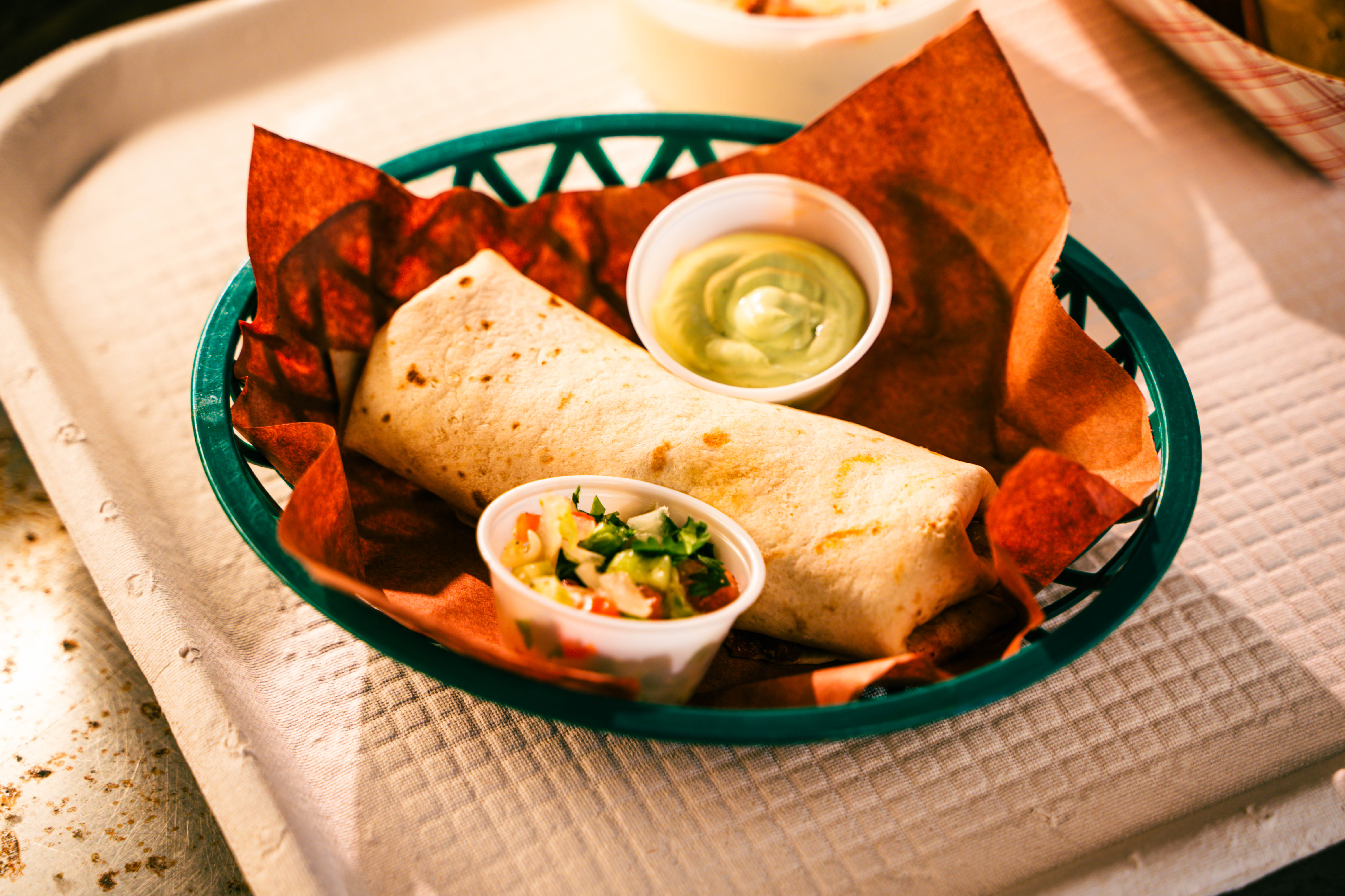 Rodeo City Provisions' signature burrito served with house-made dipping sauces